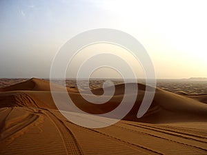 Scenic sunset landscape view of the red desert of Dubai