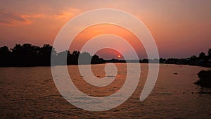 Scenic sunset view of Bang pa kong river with silhouette of mangrove forest