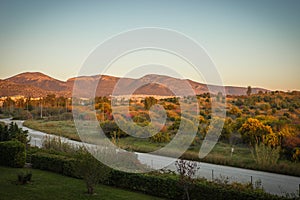 Scenic sunset view of fields and mountains in Alimos in Athens, Greece