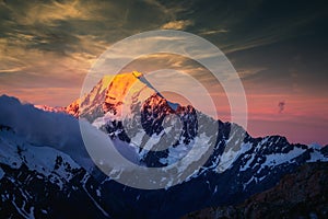 Scenic sunset view of Mt Cook summit with colorful dramatic sky, NZ