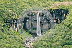 Scenic Svartifoss waterfall view from the trail in summer Iceland