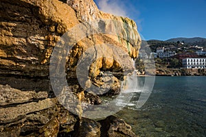 Scenic thermal waterfalls on beach in Loutro Edipsou, Evia, Gr