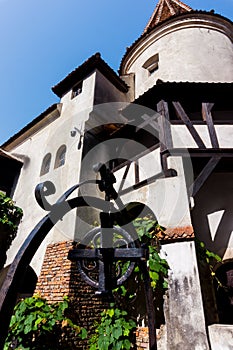 Scenic towers and the tiled roof of Bran Castle. The legendary residence of Drakula in the Carpathian Mountains, Romania