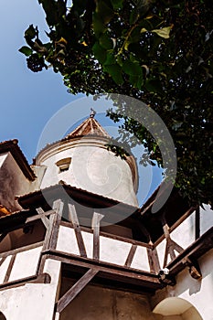 Scenic towers and tiled roof of Bran Castle. The legendary residence of Drukula in the Carpathian Mountains, Romania