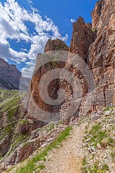 Scenic trail for hiking leading to the top of the Sassongher mountain. Italian Dolomites, Colfosco - Alta Badia.