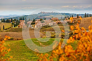 Scenic Tuscan landscape with small village on top of hill