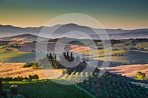 Scenic Tuscany landscape with rolling hills and valleys at sunrise