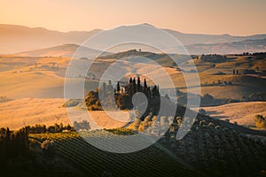 Scenic Tuscany landscape at sunrise, Val d`Orcia, Italy photo