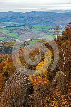 Scenic valley with colorful autumn trees. Sitno hill in Stiavnicke Vrchy, Slovakia.