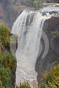 Scenic vertical shot of a waterfall in Paterson Great Falls National Park