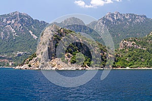 Scenic view of the Aegean Islands. The unique shades of the sea and the rocks covered with pine trees