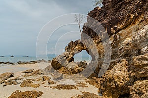 Scenic view at Ao khao kwai beach on Phayam island. Called Hin Ta Lu  Through rock