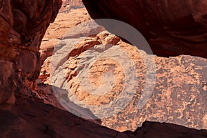 Scenic view of arch rock formation seen from the staircase of Atlatl rock in Valley of Fire State Park in Mojave desert