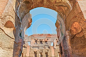 Scenic view through arch on the ruins of the ancient roman Baths of Caracalla ( Thermae Antoninianae )