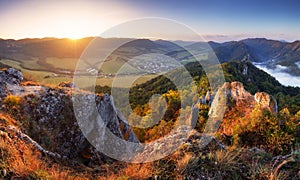 Scenic view of autumn mountain landscape with foggy valley. The Sulov Rocks, national nature reserve in northwest of Slovakia,