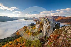 Scenic view of autumn mountain landscape with foggy valley