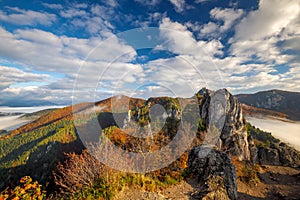 Scenic view of autumn mountain landscape with foggy valley