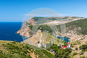 Scenic view of Balaclava bay with yachts and ruines of Genoese fortress Chembalo. Balaklava, Sevastopol, Crimea. The concept of an