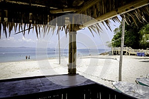 Scenic view from bamboo hut,beautiful tropical white sandy beach at sunny day