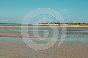 Scenic view of beach against blue sky at the Manda Island in Lamu Island UNESCO World Heritage Site in Kenya