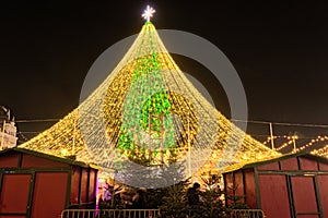 Scenic view of beautiful Main Ukraine`s New Year tree on Sophia Square in Kyiv. Fairy-tale decorated tree and Christmas market