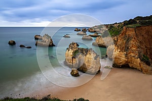 Scenic view of the beautiful Praia do Alemao and the Ponta Joao de Arens in Portimao, Algarve