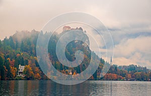 Scenic view of Bled lake at foggy autumn morning