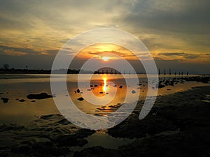 Scenic view of a calm sea during a beautiful sunset sky