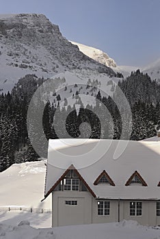 Scenic view of Carpathian Mountains during the winter with cabins or various human settlements
