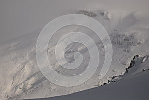 Scenic view of Carpathian Mountains during the winter with cabins or various human settlements