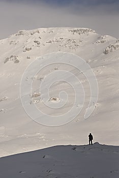 Scenic view of Carpathian Mountains during the winter with cabins or various human settlements