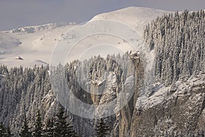 Scenic view of Carpathian Mountains during the winter with cabins or various human settlements photo