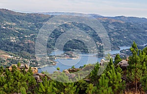 Scenic view of the Cavado river and the surrounding mountains in Peneda Geres National Park, Portugal photo