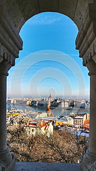 Scenic view of central Budapest and the banks of the Danube with a stone arch frame