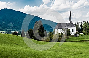 Scenic view of a chapel and green hills over the German countryside in the village Kappel