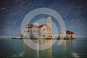 Scenic view of Church of Our Lady of Skrpjela in the morning sun photo