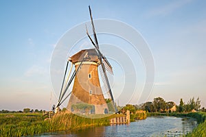 Scenic view of classic dutch windmill along the water
