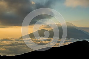 Scenic view of clouds and mist at sunrise