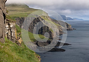 Scenic view of coast of Mykines