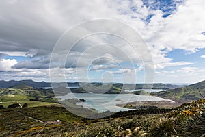 Scenic view of the coastline of New Zealand`s Otago Peninsula with campervan