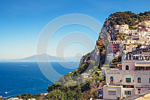 Scenic view of colorful houses on Capri island with Vesuvio background photo