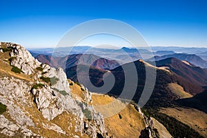 Scenic view of colorful misty mountain hills in fall