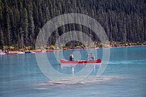 Scenic view of a couple canoeing on Lake Louise in Banff National Park, Canada