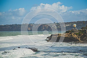 Scenic view of a cove with a beach full of cliffs in La Jolla, San Diego, CA, USA