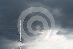 Scenic view of dark thunderstorm cloudscape over the high voltage tower