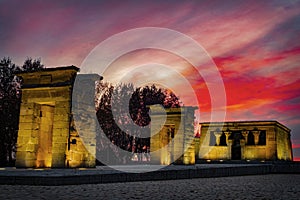 Scenic view of Debod Egyptian temple illuminated at pink sunset in Madrid, Spain