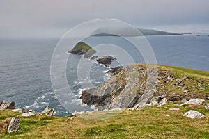 Scenic view from the dingle peninsula in Ireland. Rain clouds above the Irish coastline