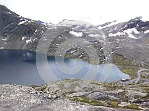 A scenic view of the Djupvatnet lake near the Geiranger fjord in Norway