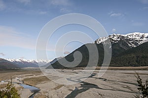 Scenic view of drought a mountainous landscape against a blue sky