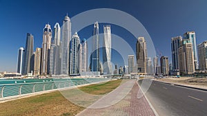 Scenic view of Dubai Marina Skyscrapers with boats timelapse hyperlapse, Skyline, View from sea, United Arab Emirates